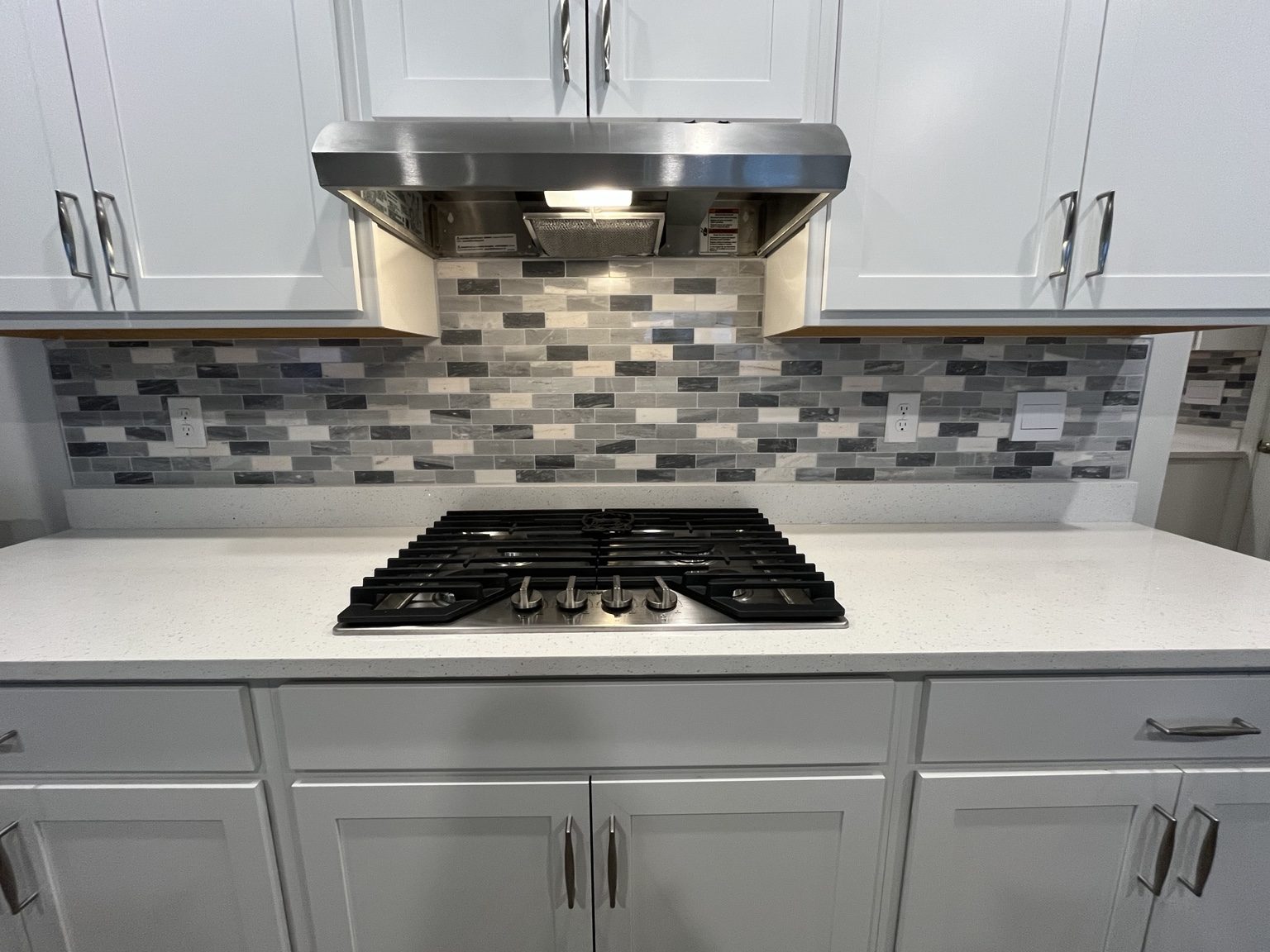 White kitchen with tile backsplash